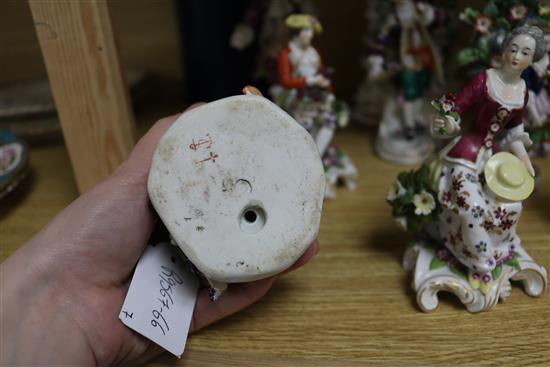 Eight porcelain figures and a floral encrusted thermometer